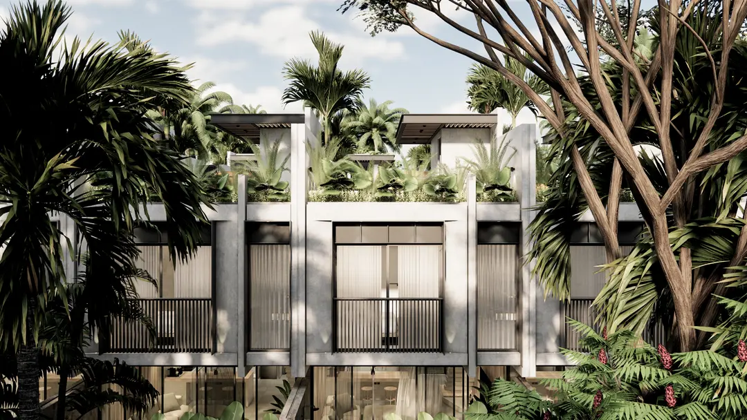 Modern minimalist villa exterior in Bali, framed by tropical foliage
